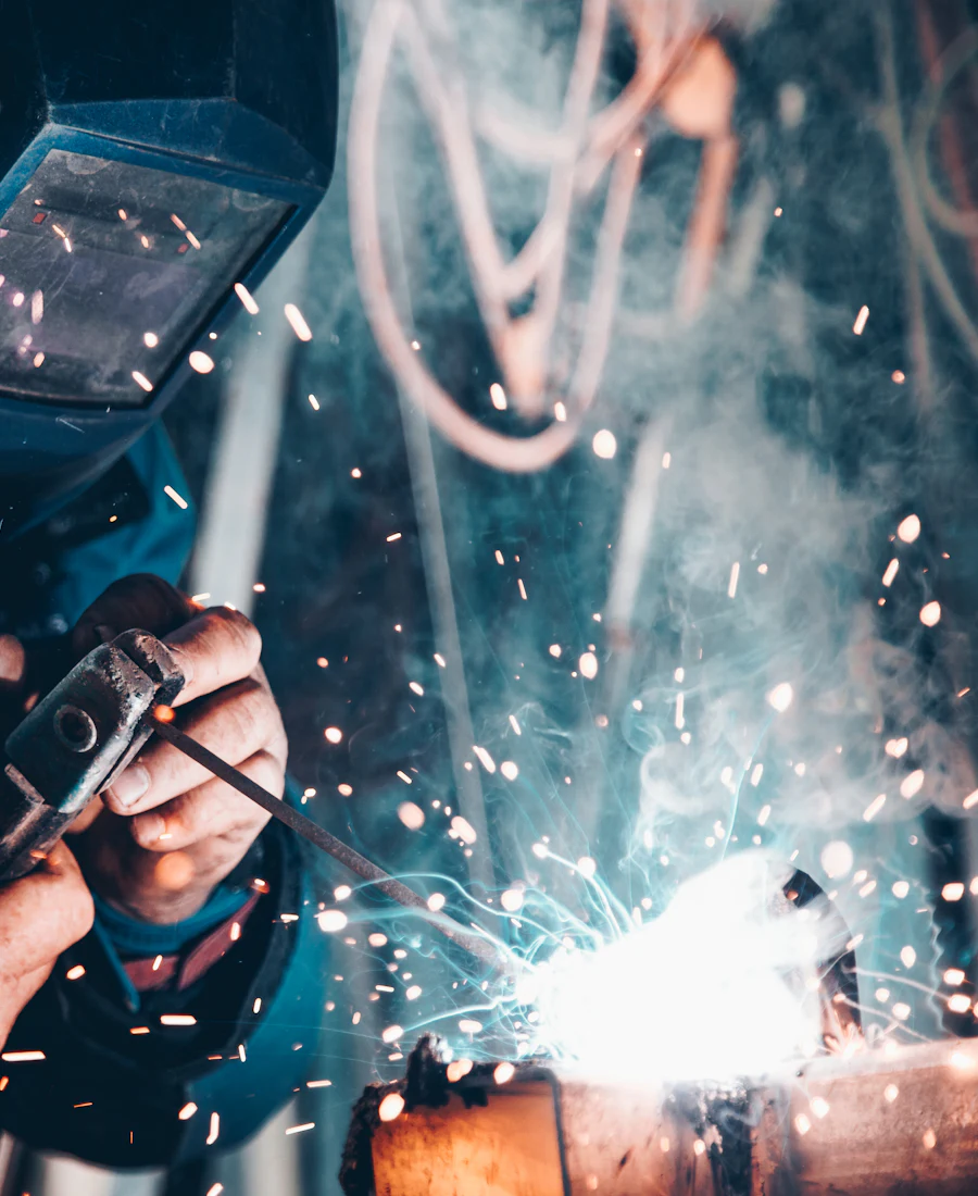 Welder at work with sparks